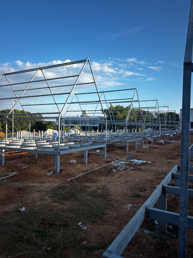 Steel framing row under sky